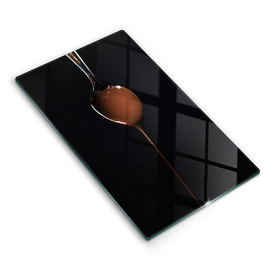 Chopping board glass Spoon of chocolate