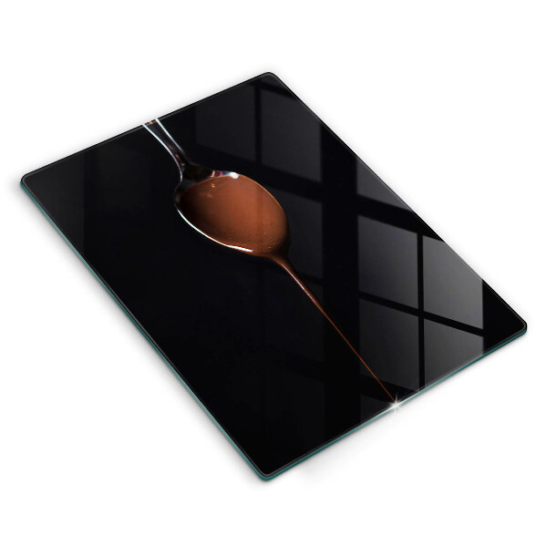 Chopping board glass Spoon of chocolate