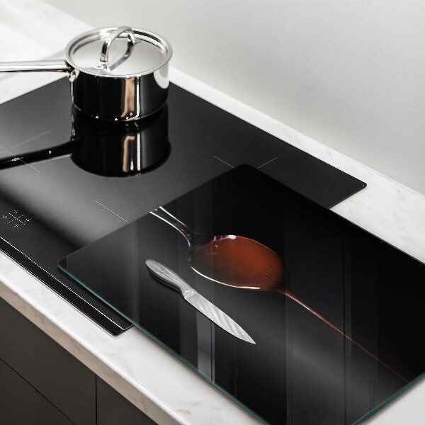 Chopping board glass Spoon of chocolate