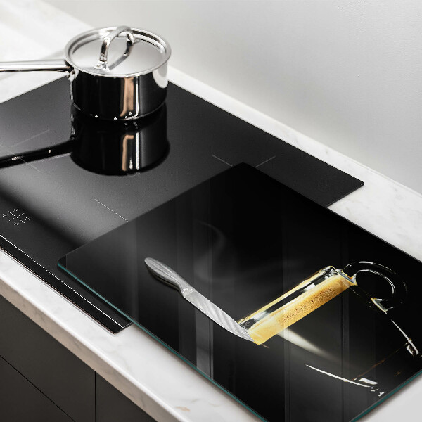 Chopping board glass A glass of black coffee