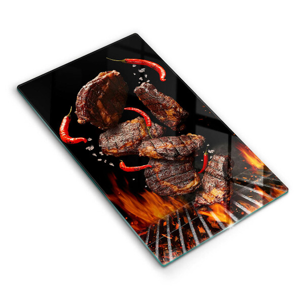 Chopping board glass Meat on the grill