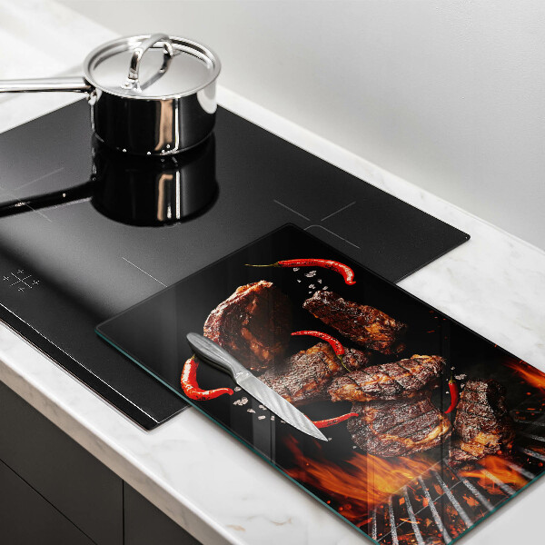 Chopping board glass Meat on the grill