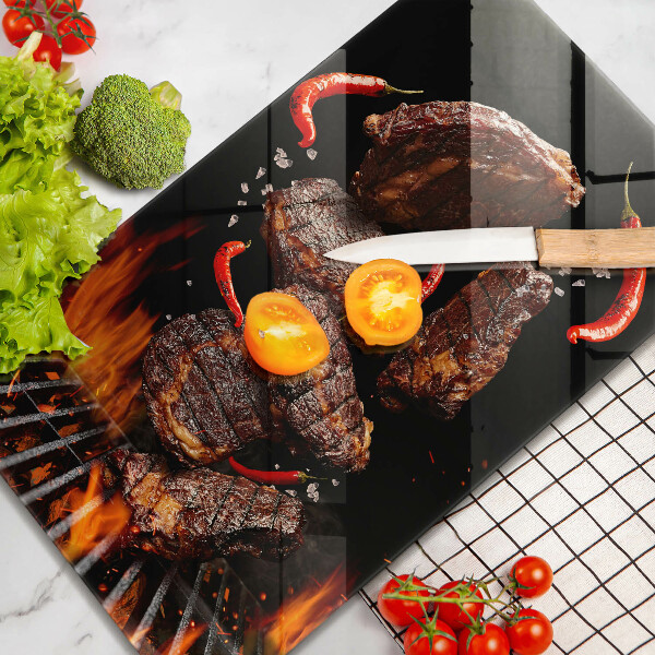 Chopping board glass Meat on the grill