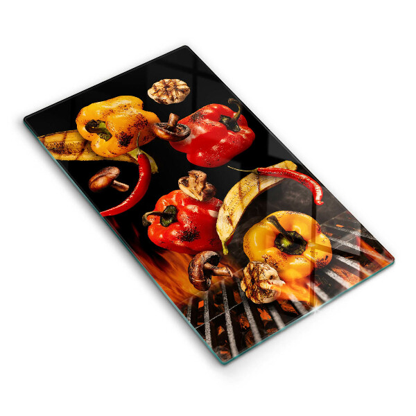 Chopping board glass Vegetables on the grill