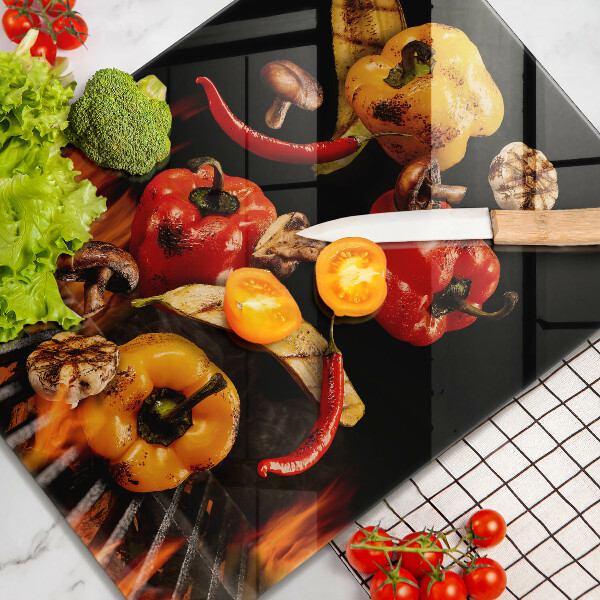 Chopping board glass Vegetables on the grill
