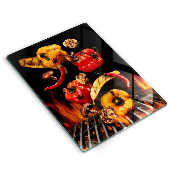 Chopping board glass Vegetables on the grill