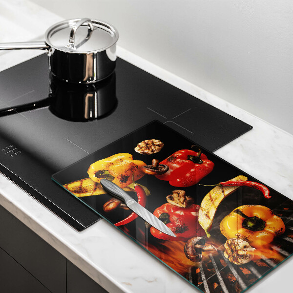 Chopping board glass Vegetables on the grill