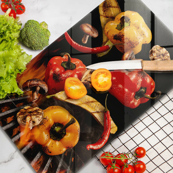 Chopping board glass Vegetables on the grill