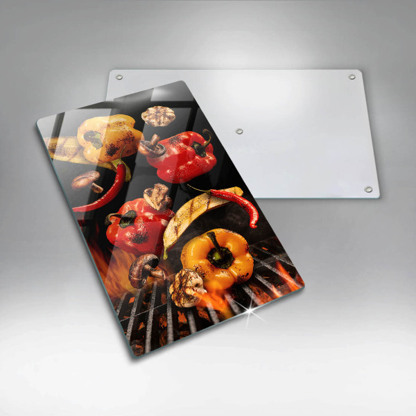 Chopping board glass Vegetables on the grill