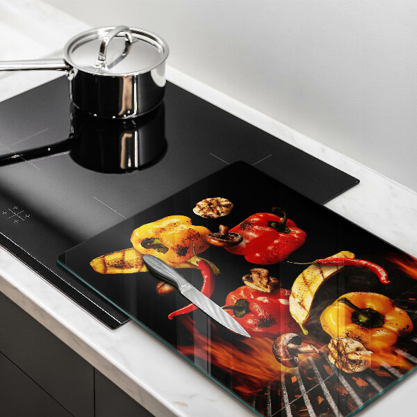 Chopping board glass Vegetables on the grill