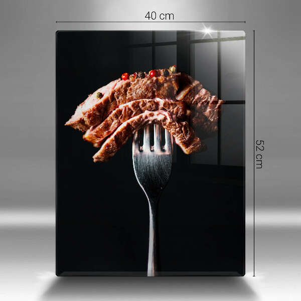 Chopping board glass Meat on a fork