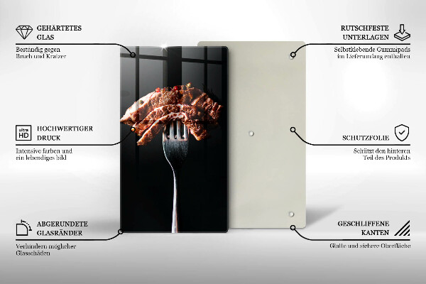Chopping board glass Meat on a fork