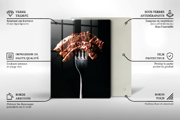 Chopping board glass Meat on a fork