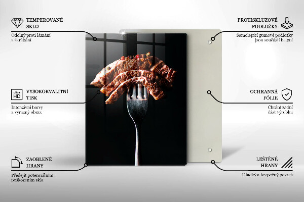 Chopping board glass Meat on a fork
