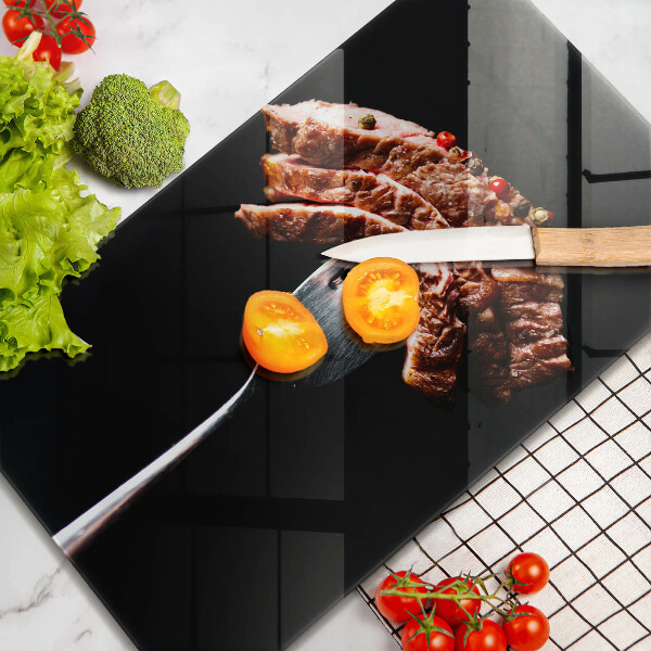 Chopping board glass Meat on a fork