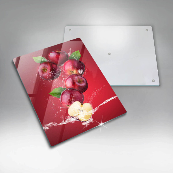 Chopping board glass Juicy apples in the water