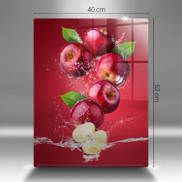 Chopping board glass Juicy apples in the water