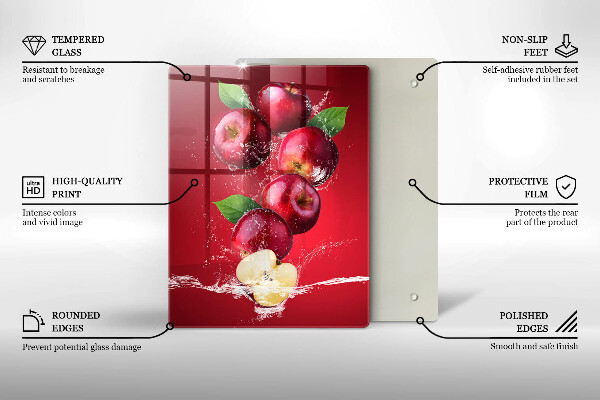 Chopping board glass Juicy apples in the water