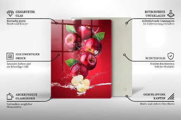 Chopping board glass Juicy apples in the water
