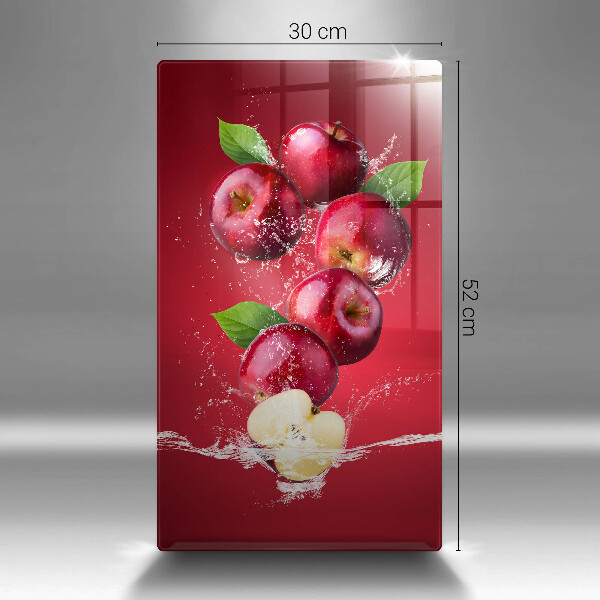 Chopping board glass Juicy apples in the water