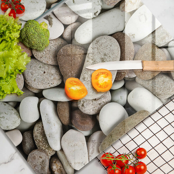 Glass chopping board Background small stones