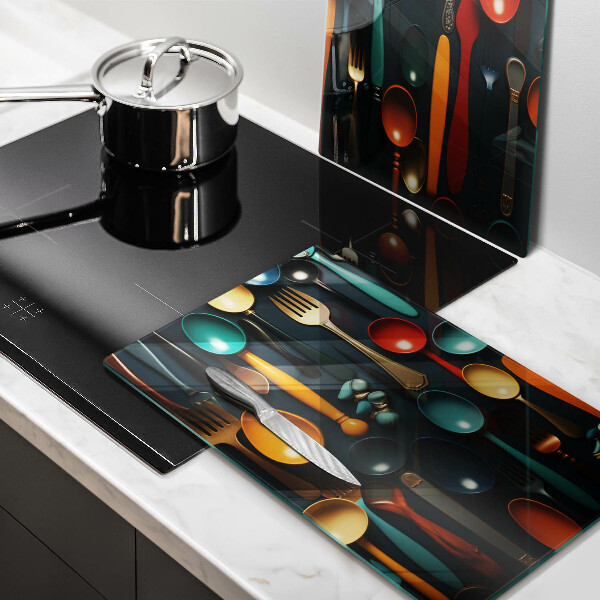 Chopping board Colorful spoons and forks
