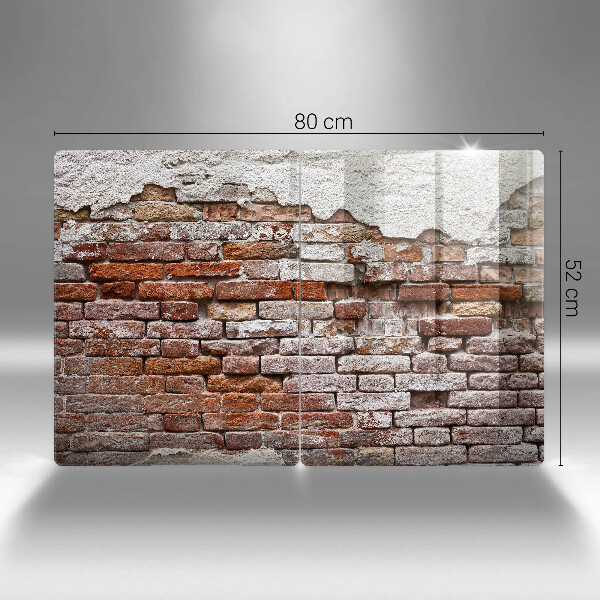 Glass chopping board Old wall of brick and concrete