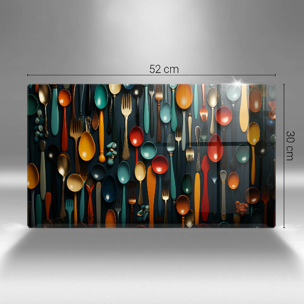 Chopping board Colorful spoons and forks