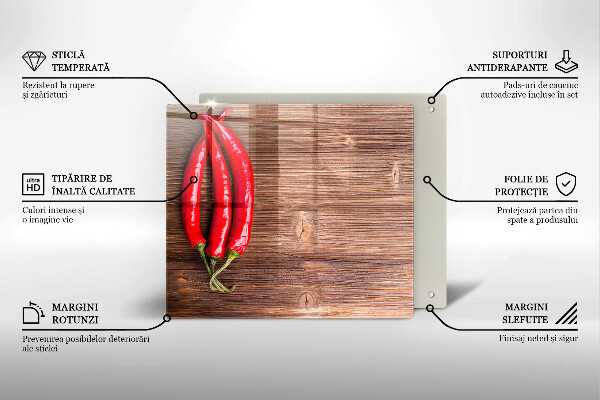 Chopping board glass Chili peppers on wood