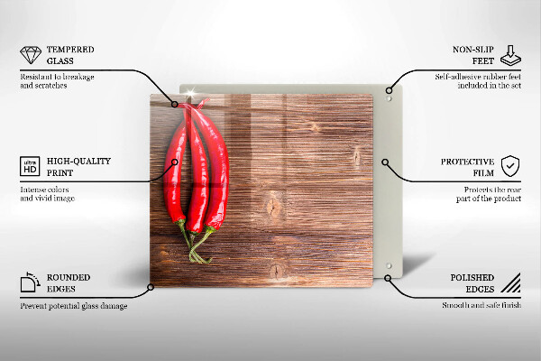 Chopping board glass Chili peppers on wood
