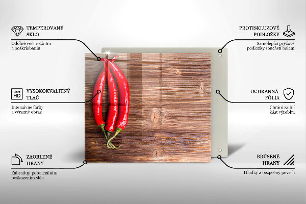 Chopping board glass Chili peppers on wood