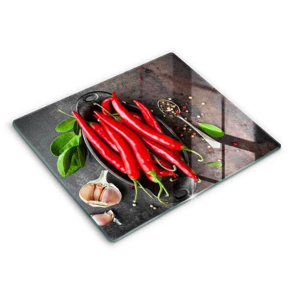 Chopping board glass Red chili peppers