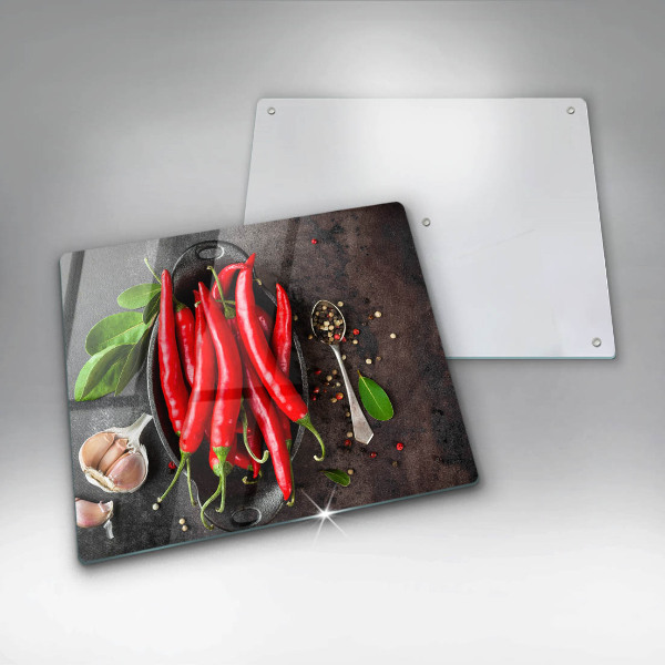 Chopping board glass Red chili peppers