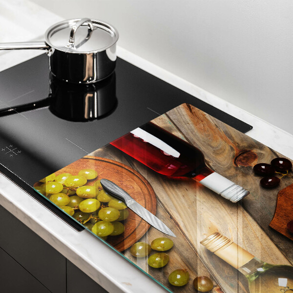 Cutting board Bottles of wine and grapes