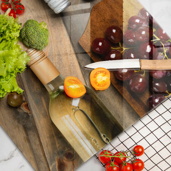 Cutting board Bottles of wine and grapes