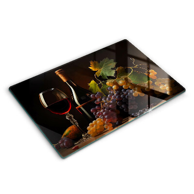 Cutting board A glass of wine and grapes
