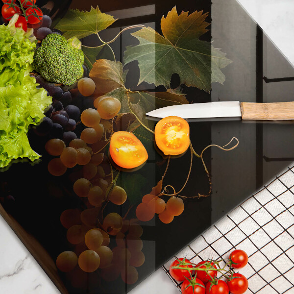 Cutting board A glass of wine and grapes