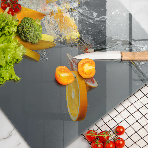Chopping board glass Lemons in water