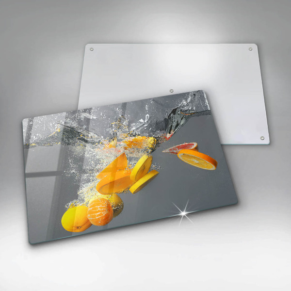 Chopping board glass Lemons in water