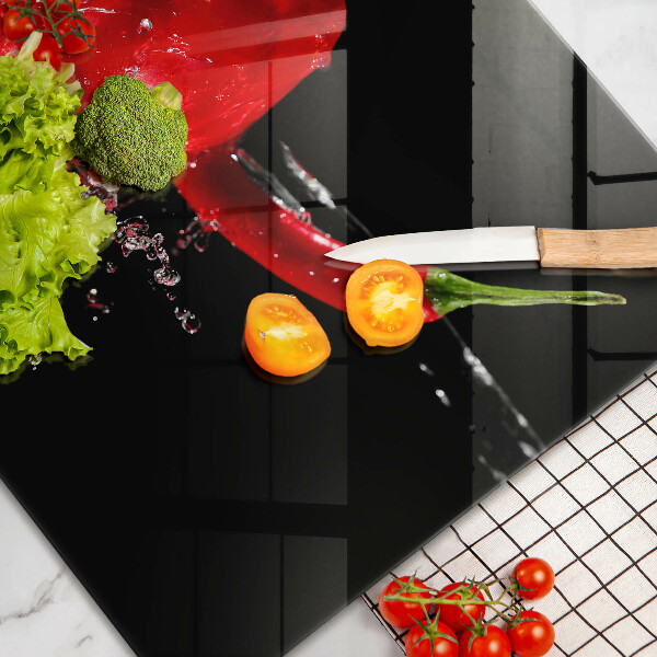 Cutting board Red peppers in water