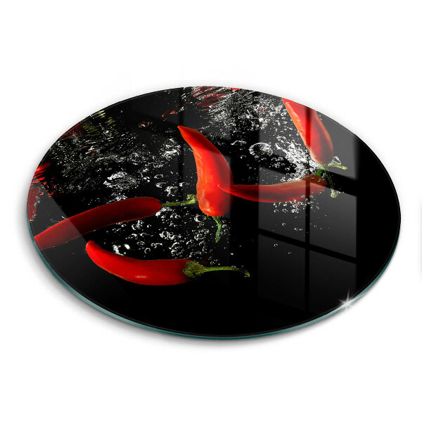 Chopping board glass Chili peppers in water