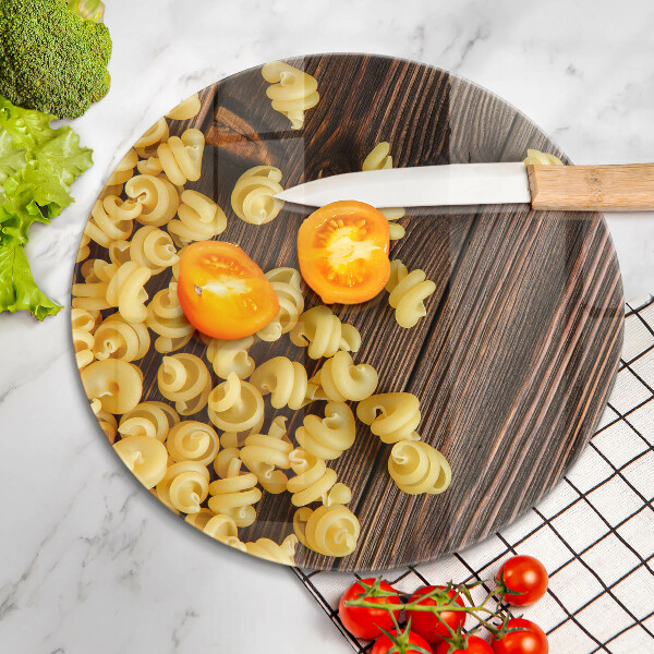 Chopping board glass Pasta on a table