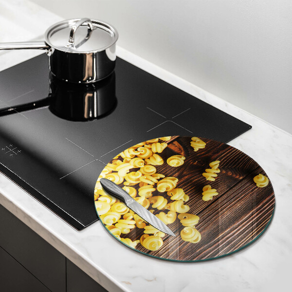 Chopping board glass Pasta on a table
