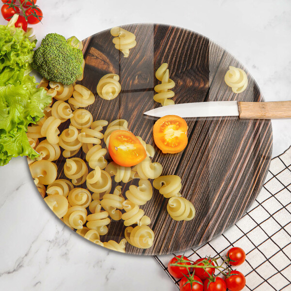 Chopping board glass Pasta on a table