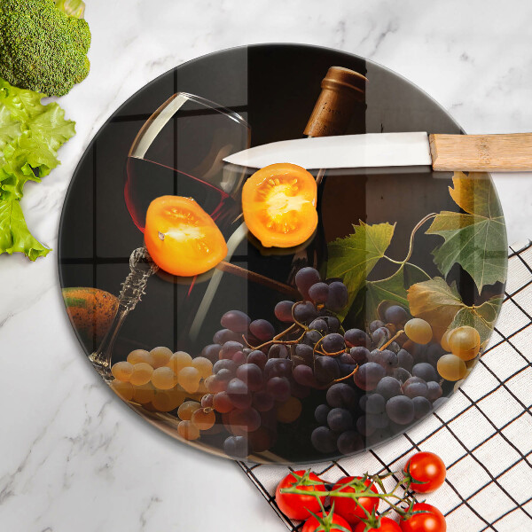 Chopping board glass A glass of wine and grapes
