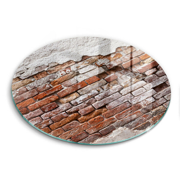 Chopping board glass Old wall of brick and concrete