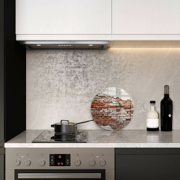 Chopping board glass Old wall of brick and concrete