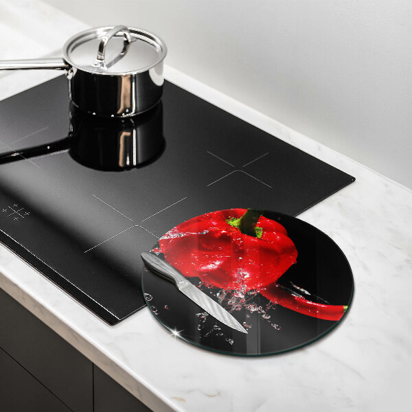 Chopping board glass Red peppers in water