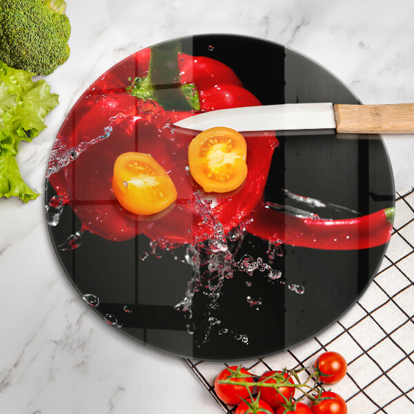 Chopping board glass Red peppers in water