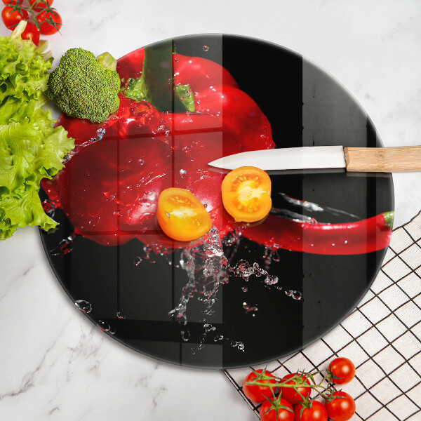 Chopping board glass Red peppers in water